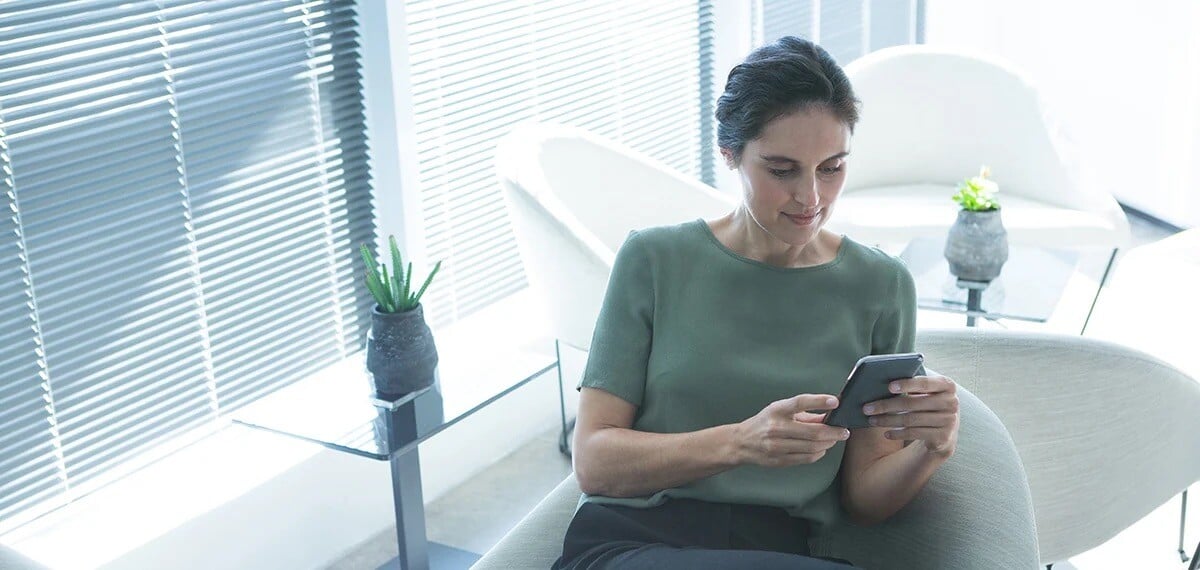 female-executive-using-mobile-phone-2021-08-28-16-46-31-utc